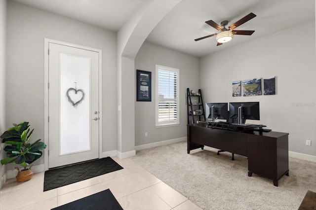 carpeted home office with ceiling fan