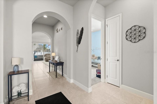 hallway with light tile patterned flooring