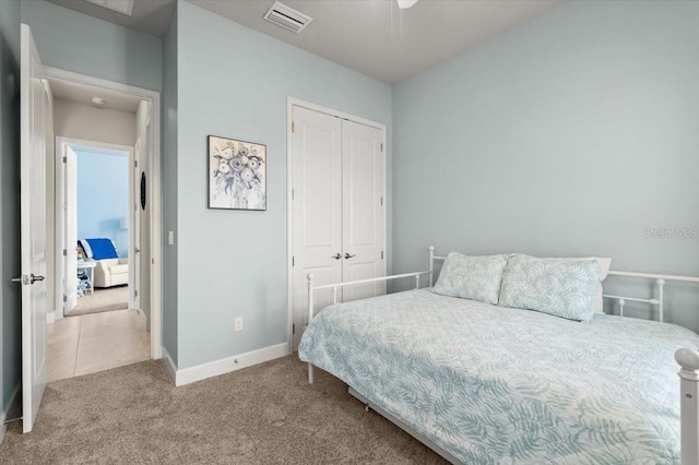 carpeted bedroom featuring a closet