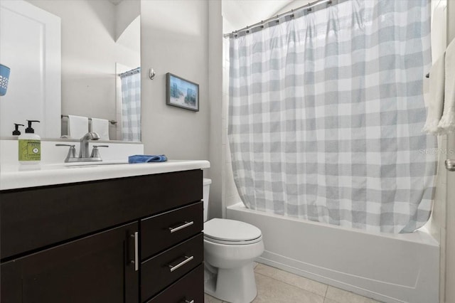 full bathroom featuring vanity, toilet, tile patterned floors, and shower / bath combo with shower curtain