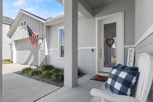 doorway to property with a garage