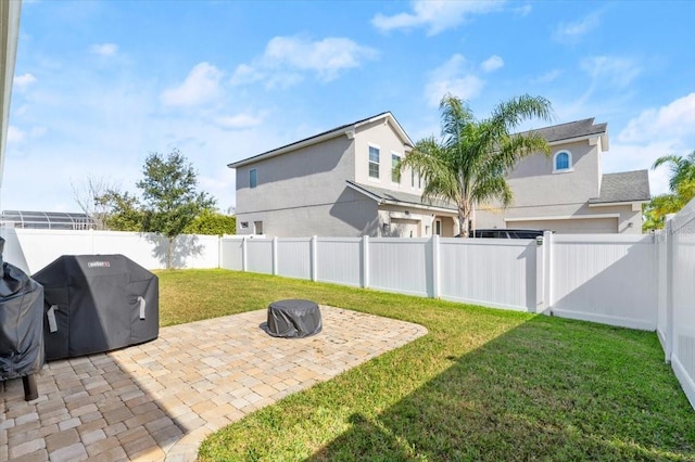 view of yard featuring a patio area and an outdoor fire pit