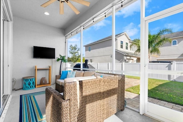 sunroom with ceiling fan