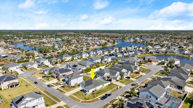 drone / aerial view with a water view