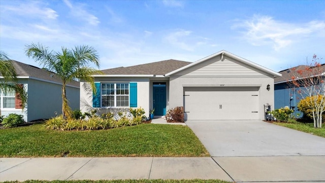 single story home with a garage and a front lawn