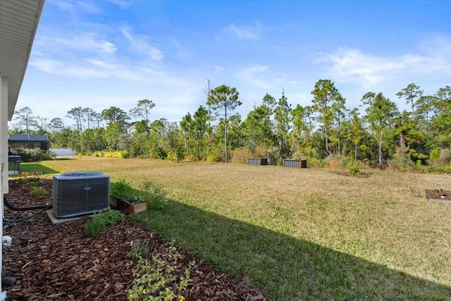 view of yard with central AC unit