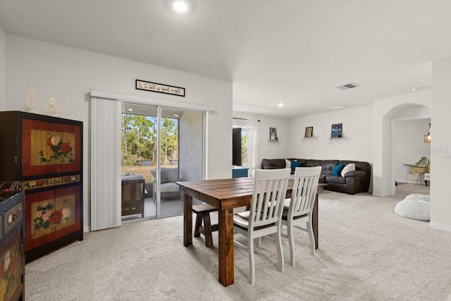 view of carpeted dining space