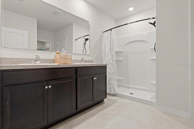 bathroom with tile patterned flooring, vanity, and a shower with curtain