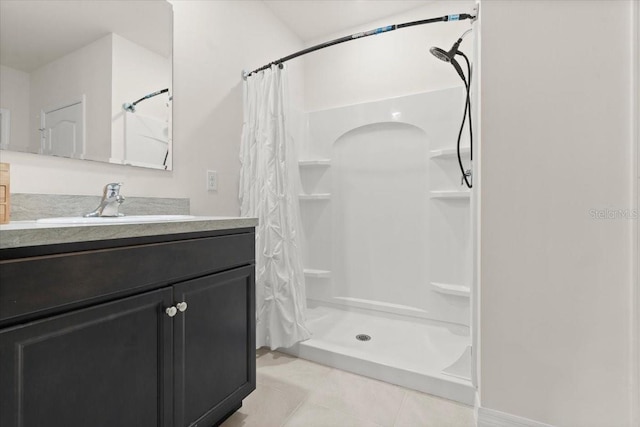 bathroom with vanity, curtained shower, and tile patterned floors