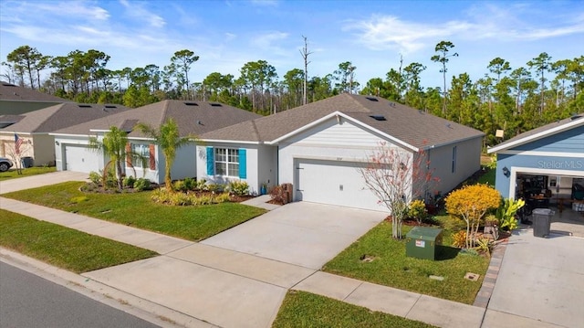 ranch-style house with a garage and a front lawn