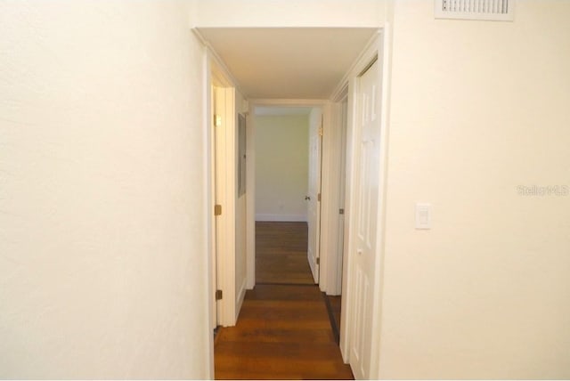 hallway featuring dark hardwood / wood-style floors