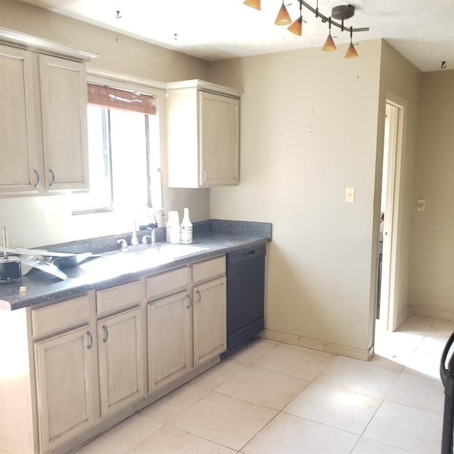 kitchen featuring light tile patterned flooring, sink, black dishwasher, and light brown cabinets