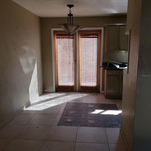 unfurnished dining area featuring light tile patterned flooring