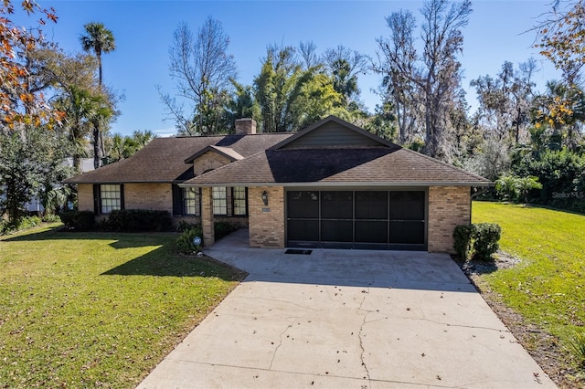 ranch-style house featuring a garage and a front yard