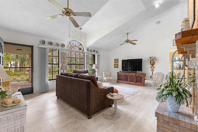 living room with high vaulted ceiling, light tile patterned floors, and ceiling fan