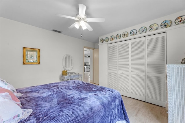 bedroom with a closet, ceiling fan, and light wood-type flooring