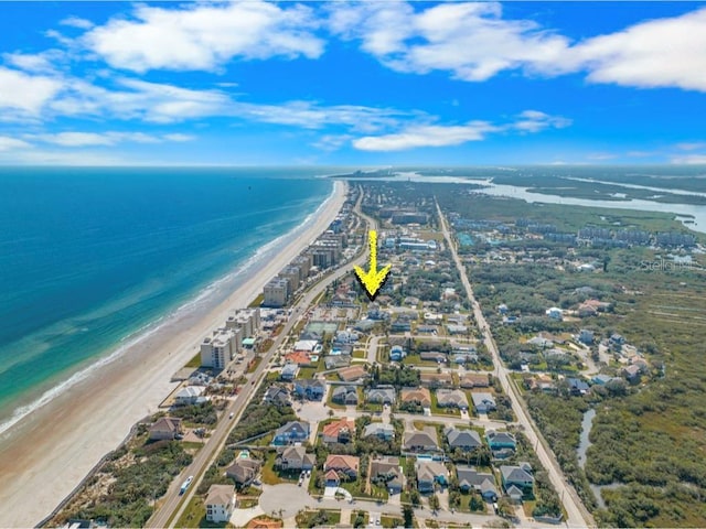 bird's eye view with a water view and a view of the beach