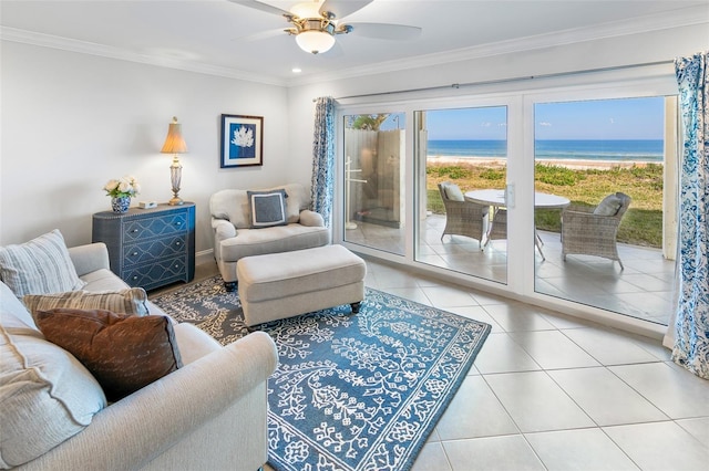 tiled living room with ornamental molding, a water view, and a wealth of natural light