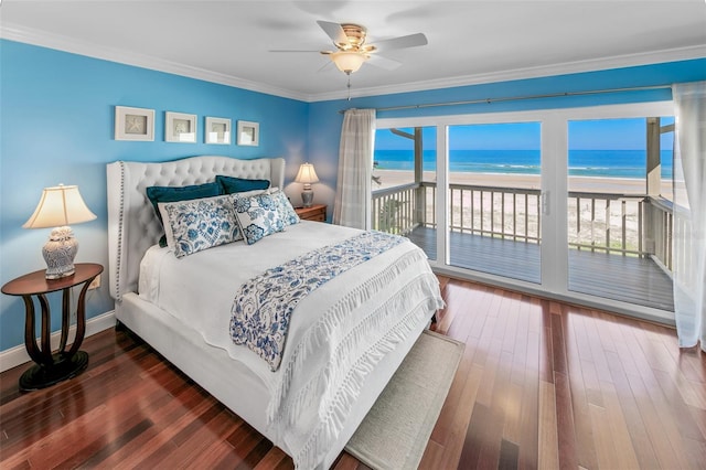 bedroom with a water view, ornamental molding, a beach view, dark hardwood / wood-style flooring, and access to outside