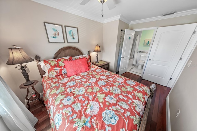 bedroom with crown molding, ceiling fan, ensuite bathroom, and dark hardwood / wood-style flooring