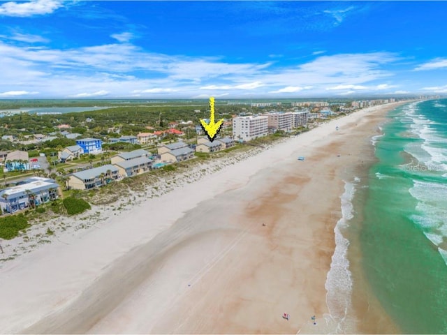 aerial view featuring a water view and a view of the beach