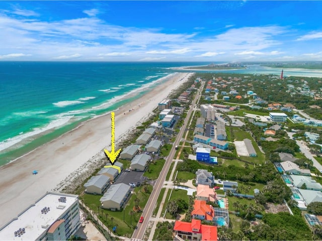 drone / aerial view featuring a view of the beach and a water view