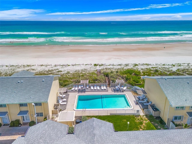 birds eye view of property featuring a water view and a view of the beach