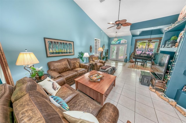 living room featuring light tile patterned flooring, high vaulted ceiling, ceiling fan, and french doors