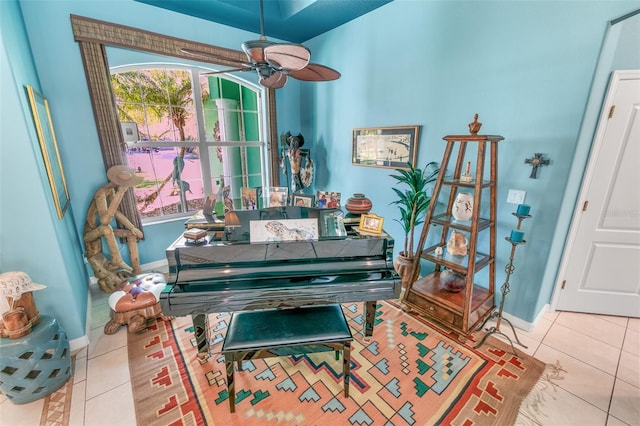 misc room with ceiling fan and light tile patterned floors