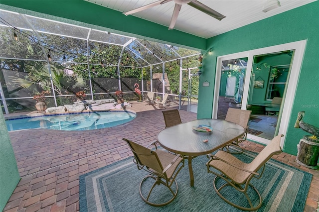 view of swimming pool with a lanai and a patio area