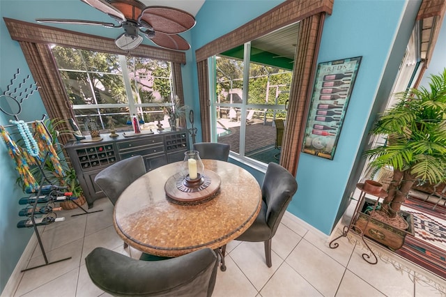 sunroom featuring ceiling fan