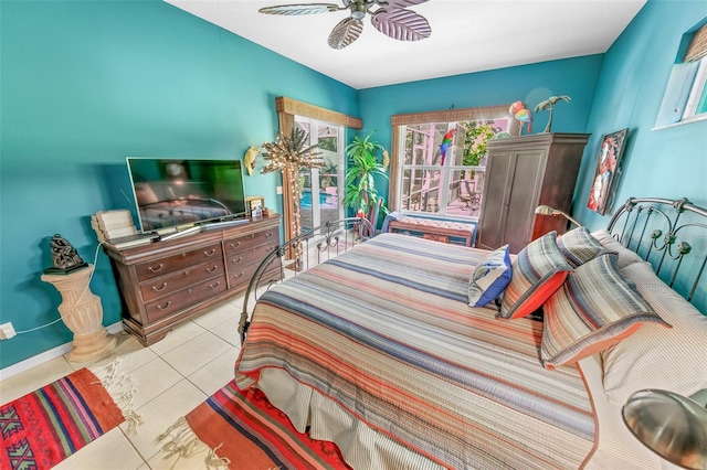 bedroom featuring light tile patterned floors and ceiling fan