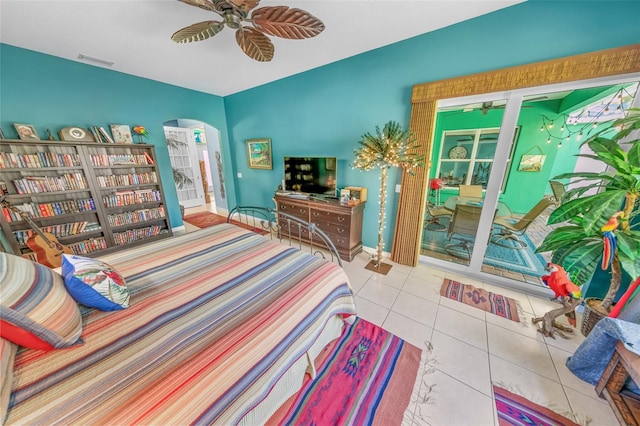 bedroom with tile patterned flooring and ceiling fan