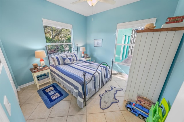 bedroom featuring light tile patterned floors and ceiling fan