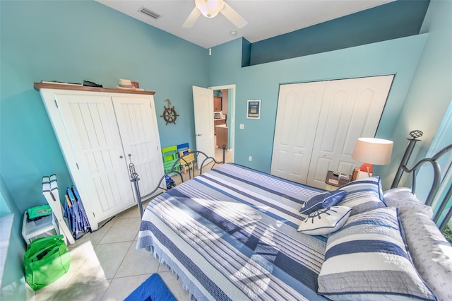 tiled bedroom with a closet and ceiling fan