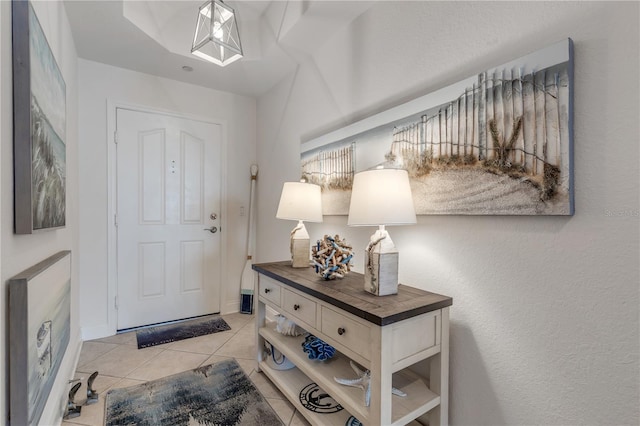 foyer featuring light tile patterned floors