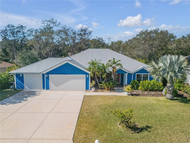 view of front facade featuring a garage and a front lawn