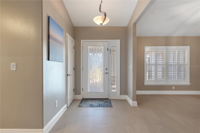 entrance foyer featuring light tile patterned floors