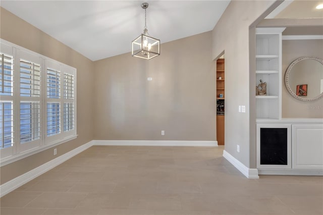 unfurnished dining area with built in features and a notable chandelier