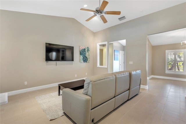 tiled living room featuring ceiling fan and lofted ceiling