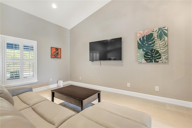 living room featuring lofted ceiling