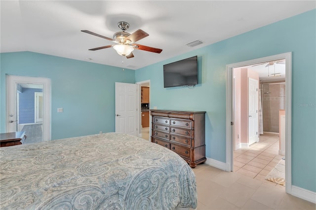 tiled bedroom featuring vaulted ceiling and ceiling fan