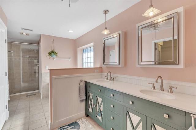 bathroom featuring walk in shower, tile patterned floors, and vanity