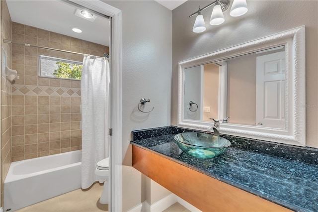 full bathroom featuring vanity, tile patterned floors, toilet, and shower / bath combo with shower curtain