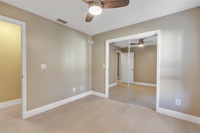 unfurnished bedroom featuring a closet and ceiling fan