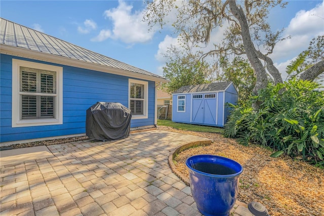 view of patio / terrace with a shed