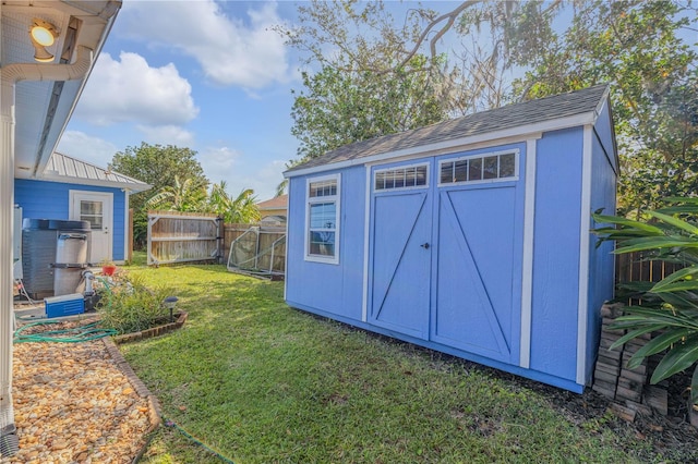 view of outbuilding with a lawn