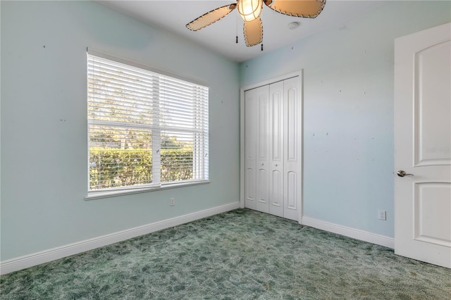 unfurnished bedroom with light colored carpet, a closet, and ceiling fan