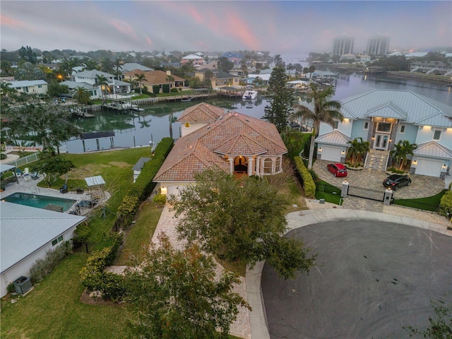 aerial view at dusk with a water view