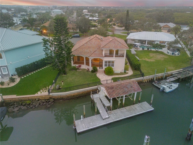 aerial view at dusk with a water view